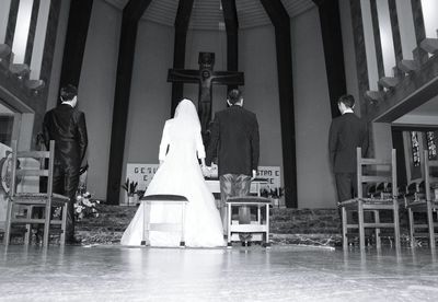 Rear view of bride and bridegroom in church