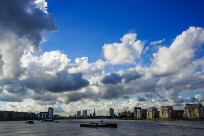 Scenic view of sea and buildings against sky