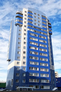 Low angle view of modern building against sky