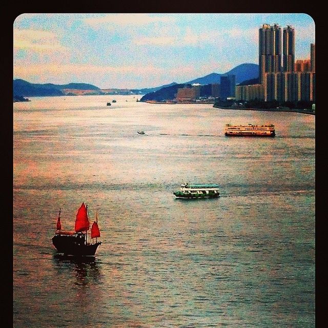 transfer print, water, nautical vessel, waterfront, auto post production filter, transportation, mode of transport, building exterior, boat, architecture, built structure, sky, river, sea, moored, sailing, city, travel, nature, outdoors