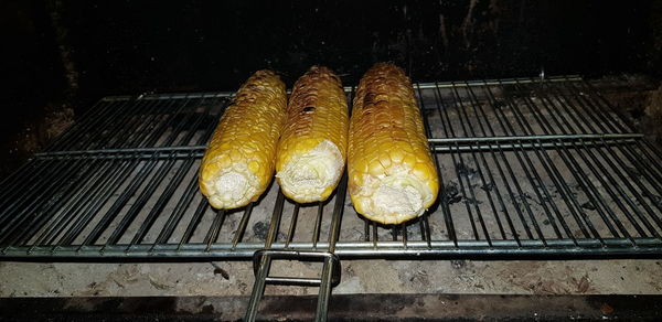 High angle view of bread on barbecue grill