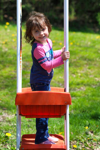 Portrait of cute girl standing outdoors