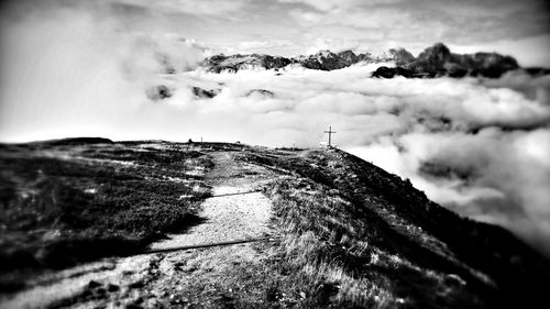 Scenic view of mountains against cloudy sky