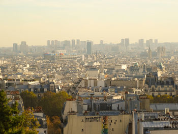 High angle view of buildings in city against clear sky