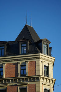 Low angle view of building against blue sky