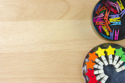 Directly above shot of colorful clothespins on table