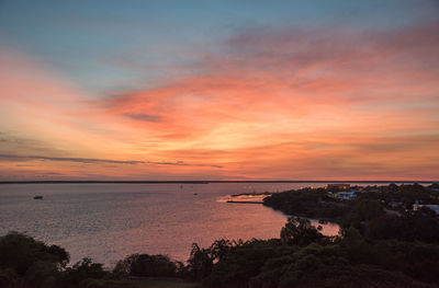 Scenic view of sea against orange sky