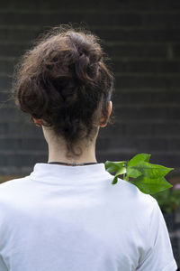 Rear view of girl by plants