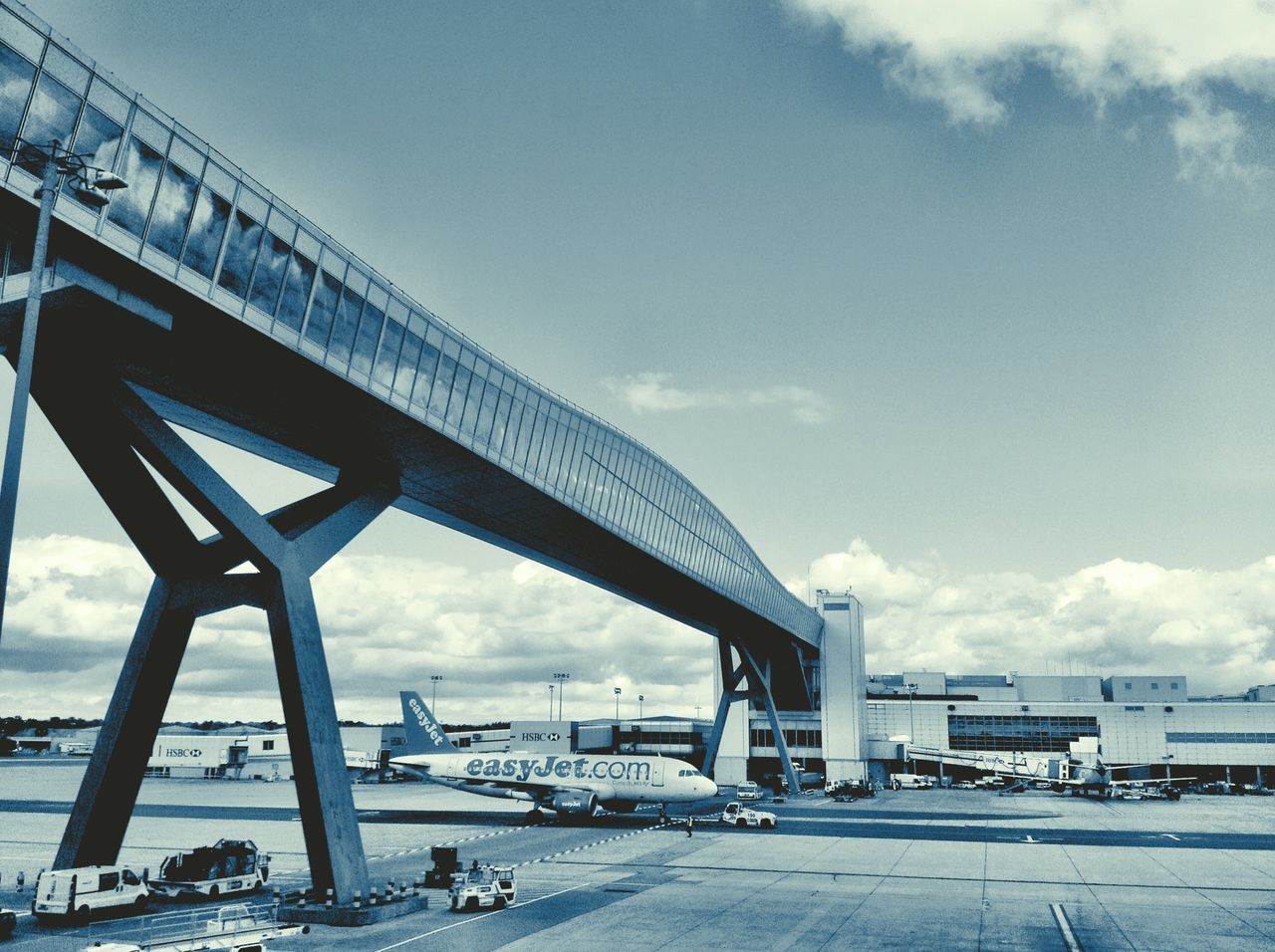 sky, built structure, architecture, connection, bridge - man made structure, transportation, sea, cloud - sky, water, engineering, cloud, low angle view, day, bridge, outdoors, cloudy, no people, railing, nature, mode of transport