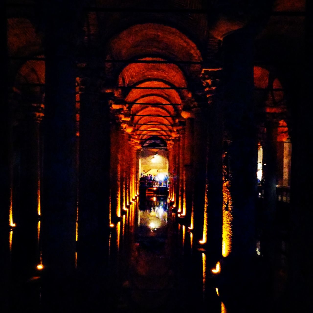 place of worship, religion, arch, spirituality, indoors, illuminated, architecture, church, built structure, architectural column, in a row, temple - building, history, dark, lighting equipment, night, old, famous place