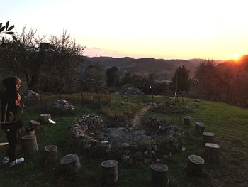 Scenic view of field against clear sky during sunset