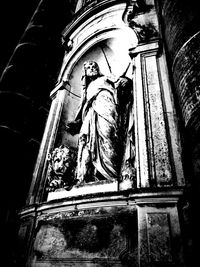 Low angle view of statue against temple