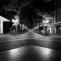 View of illuminated street at night