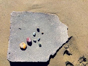 Close-up of pebbles on sand