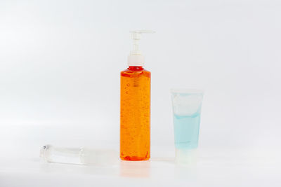 Close-up of glass bottle against white background