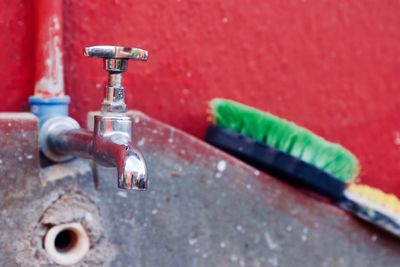 Close-up of water pipe against wall