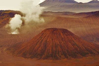 Panoramic view of volcanic landscape against sky