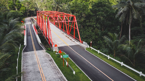 Road by bridge in city