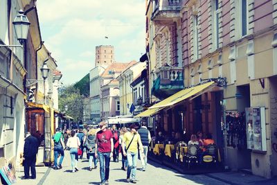 People walking on street in city