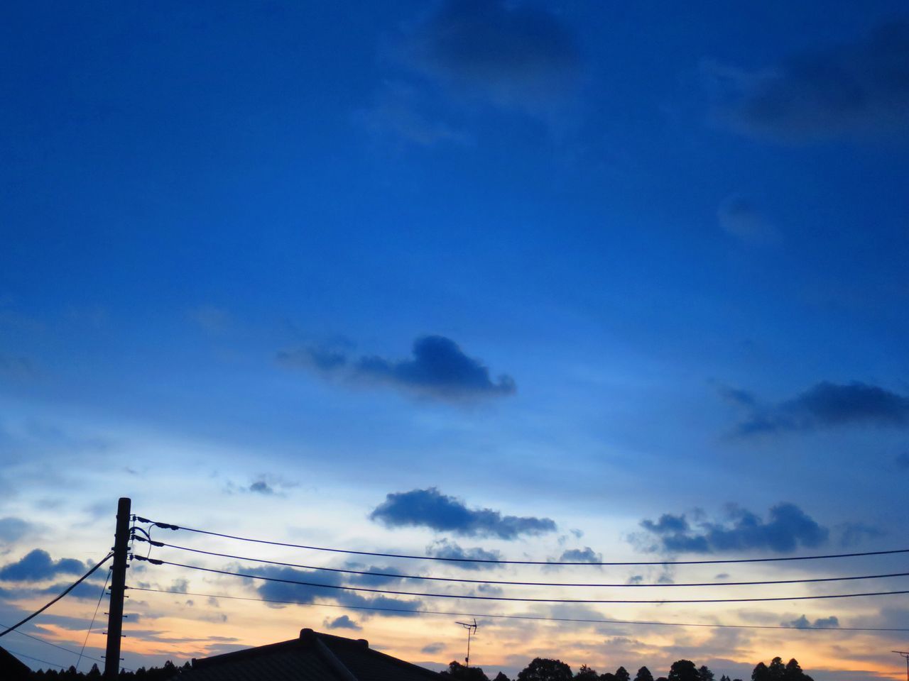 power line, electricity pylon, sky, low angle view, connection, power supply, electricity, cable, silhouette, blue, sunset, cloud - sky, fuel and power generation, power cable, technology, beauty in nature, nature, cloud, tranquility, scenics