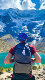 Rear view of man standing at humantay lake