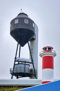 Low angle view of water tower against clear sky