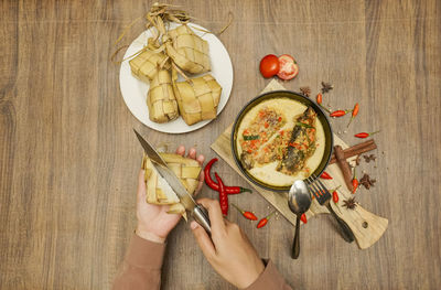 High angle view of person preparing food on table