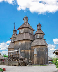 Wooden church in the national reserve khortytsia in zaporozhye, ukraine, on a sunny summer day