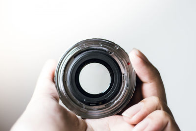 Midsection of person photographing camera