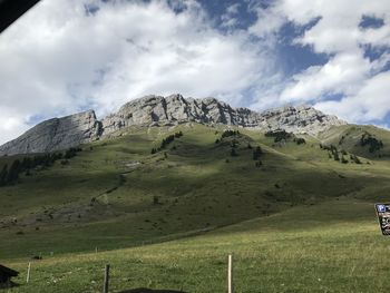 Scenic view of landscape and mountains against sky