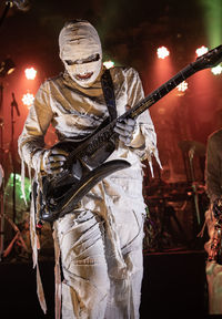 Man wearing costume performing on stage