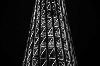 Low angle view of built structure against dark sky