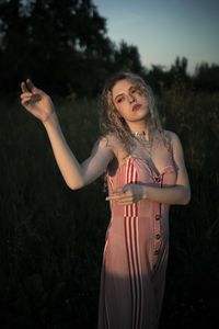 Young woman standing on field