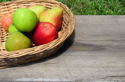 High angle view of apples in basket on table