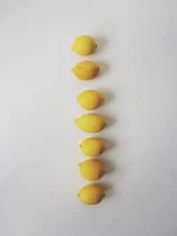 Yellow fruit against white background