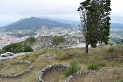 Scenic view of landscape and mountains against sky