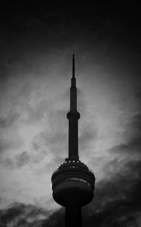 Low angle view of communications tower against sky