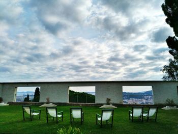 Chairs and table against sky