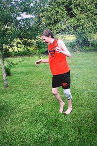 Full length of girl standing on grassy field