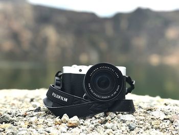 Close-up of camera on rock