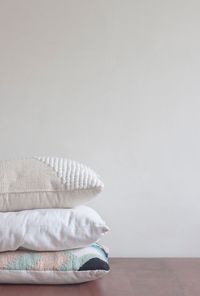 Close-up of blanket on table against wall