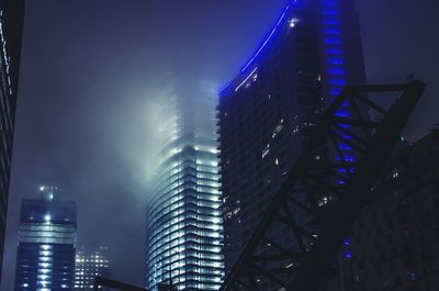 Low angle view of modern building at night