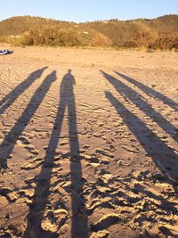 Shadow of people on sand