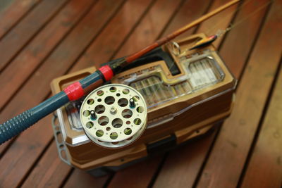 Close-up of camera on wooden wall