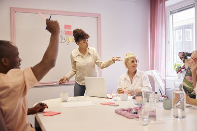 Coworkers having business meeting and talking