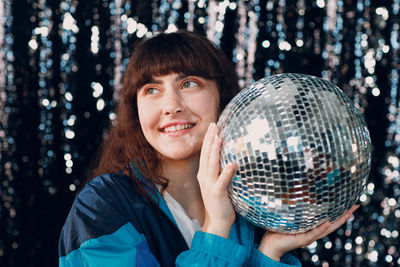 Portrait of woman holding crystal ball