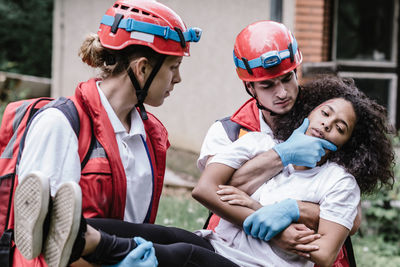 Rescue workers carrying woman