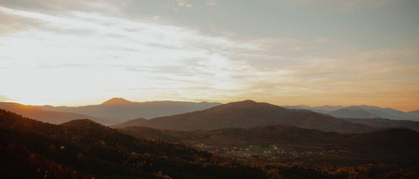 Scenic view of mountains against sky during sunset