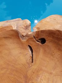 Rock formations in desert against blue sky