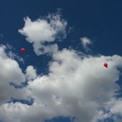 Low angle view of hot air balloon against blue sky